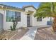 Cozy home with a welcoming walkway and easy-care desert landscaping at 1252 N Sloan Ln, Las Vegas, NV 89110