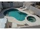 Private backyard pool and spa with sun loungers for relaxation at 1252 N Sloan Ln, Las Vegas, NV 89110