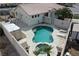 Aerial view of backyard pool with spa, patio area, and mature landscaping at 1252 N Sloan Ln, Las Vegas, NV 89110