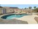 Backyard view of the refreshing swimming pool with spa, lounge chairs, and mature landscaping at 1252 N Sloan Ln, Las Vegas, NV 89110
