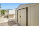 View of the backyard shed with double doors at 1252 N Sloan Ln, Las Vegas, NV 89110