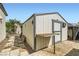 Backyard shed with folding table and exterior decoration at 1252 N Sloan Ln, Las Vegas, NV 89110