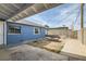 Enclosed backyard featuring a fire pit, gravel landscaping, a cinder block wall, and concrete patio at 143 Constitution Ave, Henderson, NV 89015