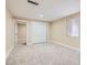 Cozy bedroom with neutral walls, plush carpeting, a window, and a closet at 143 Constitution Ave, Henderson, NV 89015