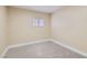 Clean bedroom featuring neutral carpet, a small window, and fresh white trim at 143 Constitution Ave, Henderson, NV 89015