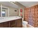 Bathroom featuring a double vanity, toilet, and a shower with a decorative curtain at 1547 Harwood Ave, Henderson, NV 89012