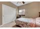 Cozy bedroom featuring a ceiling fan, and a comfortable bed with a bedside table at 1547 Harwood Ave, Henderson, NV 89012