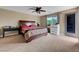 Spacious primary bedroom with a ceiling fan and lots of natural light at 1547 Harwood Ave, Henderson, NV 89012