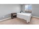 Contemporary bedroom with single bed, carpet flooring, and natural light from the window at 1547 Harwood Ave, Henderson, NV 89012