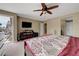 Open primary bedroom with balcony and media center at 1547 Harwood Ave, Henderson, NV 89012