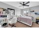 Bright bedroom featuring a work space and a ceiling fan at 1547 Harwood Ave, Henderson, NV 89012