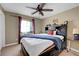 Bedroom featuring a ceiling fan, and a comfortable bed with built in drawers at 1547 Harwood Ave, Henderson, NV 89012