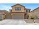 Inviting two-story home with a charming facade and a spacious three car driveway at 1547 Harwood Ave, Henderson, NV 89012
