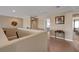 View of the carpeted hallway with decorative table on the second level of the home at 1547 Harwood Ave, Henderson, NV 89012