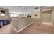 Spacious upper level hallway with neutral walls and carpeted flooring in the home at 1547 Harwood Ave, Henderson, NV 89012