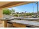 Outdoor kitchen with marble countertops providing a view of the backyard, pool, and surrounding landscaping at 1547 Harwood Ave, Henderson, NV 89012