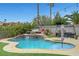 Beautiful backyard pool with built-in spa, patio furniture, and well-maintained landscaping, ideal for outdoor relaxation at 1547 Harwood Ave, Henderson, NV 89012