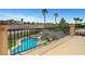 Inviting backyard featuring a sparkling pool, spa, and tropical landscaping, perfect for outdoor entertaining at 1547 Harwood Ave, Henderson, NV 89012