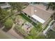 Aerial view of a home with a well-maintained backyard, a pool, and a fire pit at 1624 Preston Park Dr, Henderson, NV 89052
