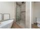 Bathroom featuring modern soaking tub, and tiled glass-enclosed shower at 1624 Preston Park Dr, Henderson, NV 89052