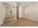 Bedroom with wood floors, ceiling fan, plantation shutters and large mirror closet doors at 1624 Preston Park Dr, Henderson, NV 89052