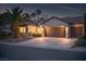 Charming home exterior featuring a three-car garage, well-manicured landscaping, and inviting curb appeal at 1624 Preston Park Dr, Henderson, NV 89052