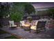 Cozy backyard fire pit area with comfortable seating, perfect for evening gatherings and relaxation at 1624 Preston Park Dr, Henderson, NV 89052