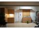 Organized garage featuring built-in cabinets, plants, and ample storage space at 1624 Preston Park Dr, Henderson, NV 89052