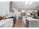 Modern kitchen boasts stainless steel appliances, white cabinetry, and a spacious island overlooking the living area at 1624 Preston Park Dr, Henderson, NV 89052