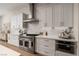 Well-appointed kitchen features stainless steel appliances, white cabinetry, and sleek countertops at 1624 Preston Park Dr, Henderson, NV 89052