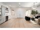 Spacious living area with a bar, stylish furniture, and large windows, offering a versatile space for relaxation and entertaining at 1624 Preston Park Dr, Henderson, NV 89052