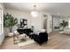 Inviting living room with modern furniture, a decorative rug, and large windows, creating a welcoming atmosphere at 1624 Preston Park Dr, Henderson, NV 89052