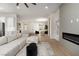 Open-concept living area showcases a sleek fireplace, modern furnishings, and seamless transition to the kitchen at 1624 Preston Park Dr, Henderson, NV 89052