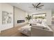 Comfortable living area with a sleek electric fireplace, plush sectional sofa, and picturesque views of the outdoor space at 1624 Preston Park Dr, Henderson, NV 89052