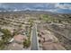 Scenic aerial view of the neighborhood showcasing desert landscaping and mountains in the background at 1624 Preston Park Dr, Henderson, NV 89052