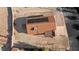 Aerial view of desert landscaped backyard with covered patio and solar panels at 1775 Esteban Ave, Laughlin, NV 89029