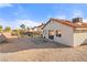 Backyard featuring desert landscaping, a stone patio, and perimeter fencing at 1775 Esteban Ave, Laughlin, NV 89029