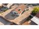 Aerial view of the backyard with desert landscaping, tile patio, and solar panels on the roof at 1775 Esteban Ave, Laughlin, NV 89029