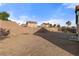 Wide backyard featuring partial block wall, fencing, and sparse landscaping at 1775 Esteban Ave, Laughlin, NV 89029
