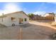 Backyard with desert landscaping featuring a stone patio at 1775 Esteban Ave, Laughlin, NV 89029