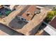 Aerial view of the backyard with desert landscaping, tile patio, and solar panels on the roof at 1775 Esteban Ave, Laughlin, NV 89029