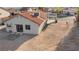 A desert landscaped backyard with an outdoor patio and a back door to enter the house at 1775 Esteban Ave, Laughlin, NV 89029