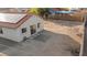 A desert landscaped backyard with an outdoor patio and a back door to enter the house at 1775 Esteban Ave, Laughlin, NV 89029