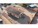Aerial view of the backyard with desert landscaping, tile patio, and solar panels on the roof at 1775 Esteban Ave, Laughlin, NV 89029