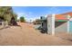 Backyard showcasing desert landscaping with block wall fencing and a covered carport at 1775 Esteban Ave, Laughlin, NV 89029