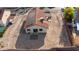 Aerial view of the backyard with desert landscaping, tile patio, and solar panels on the roof at 1775 Esteban Ave, Laughlin, NV 89029