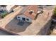 Aerial view of the backyard with desert landscaping, tile patio, and solar panels on the roof at 1775 Esteban Ave, Laughlin, NV 89029