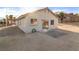 Exterior view of a home showing the backyard with desert landscaping at 1775 Esteban Ave, Laughlin, NV 89029