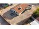 Aerial view of the backyard with desert landscaping, tile patio, and solar panels on the roof at 1775 Esteban Ave, Laughlin, NV 89029