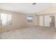 Bedroom showcasing neutral carpet, ample natural light, and direct access to other rooms at 1775 Esteban Ave, Laughlin, NV 89029